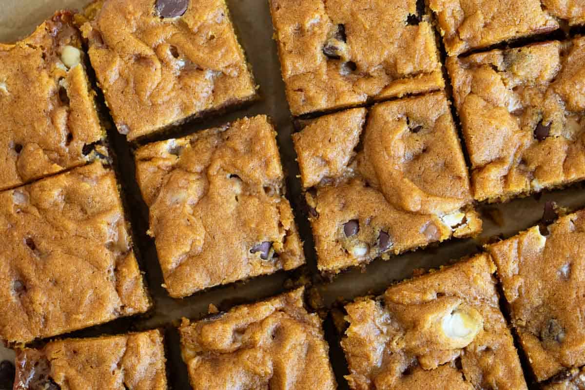 Loaded Caramel Pumpkin Blondies cut into bars.