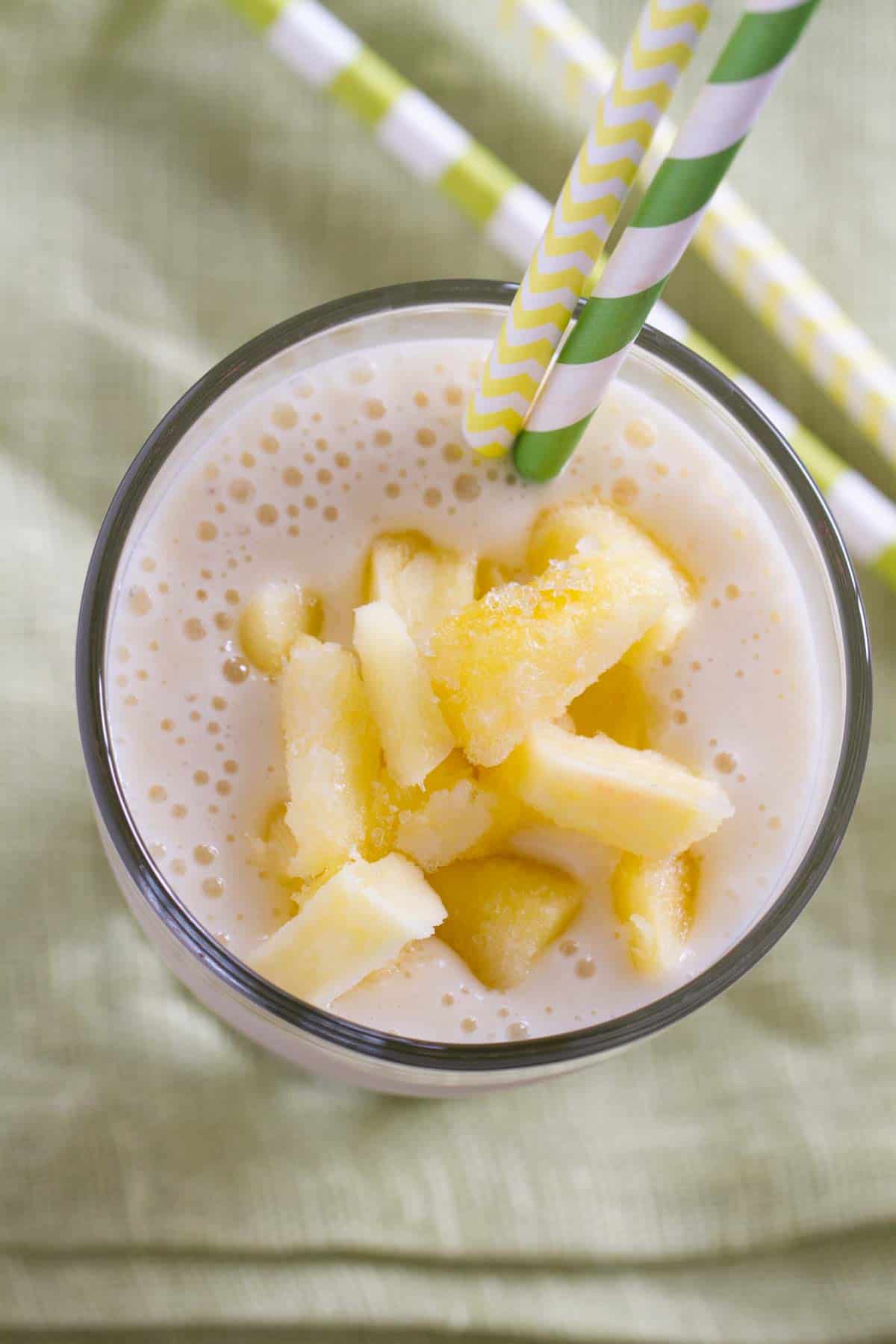 Top view of Pineapple Banana Smoothie topped with pineapple.