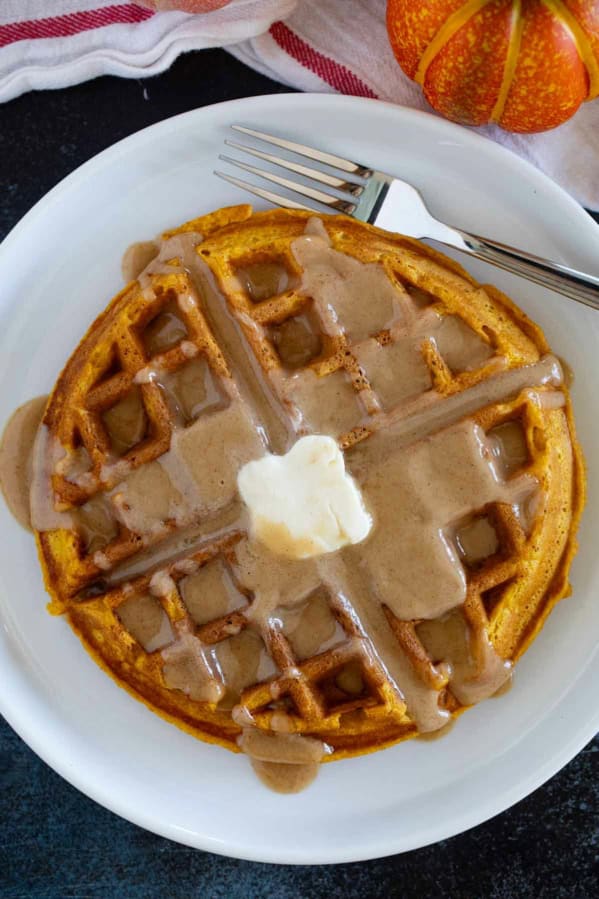 Pumpkin Waffle with cinnamon syrup and butter.