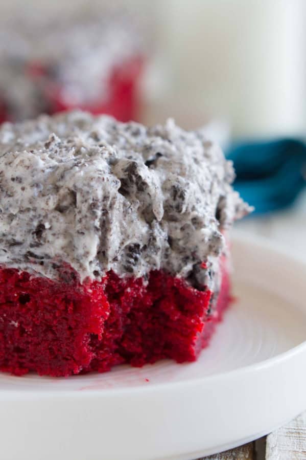 Slice of red velvet sheet cake with a bite taken from it.