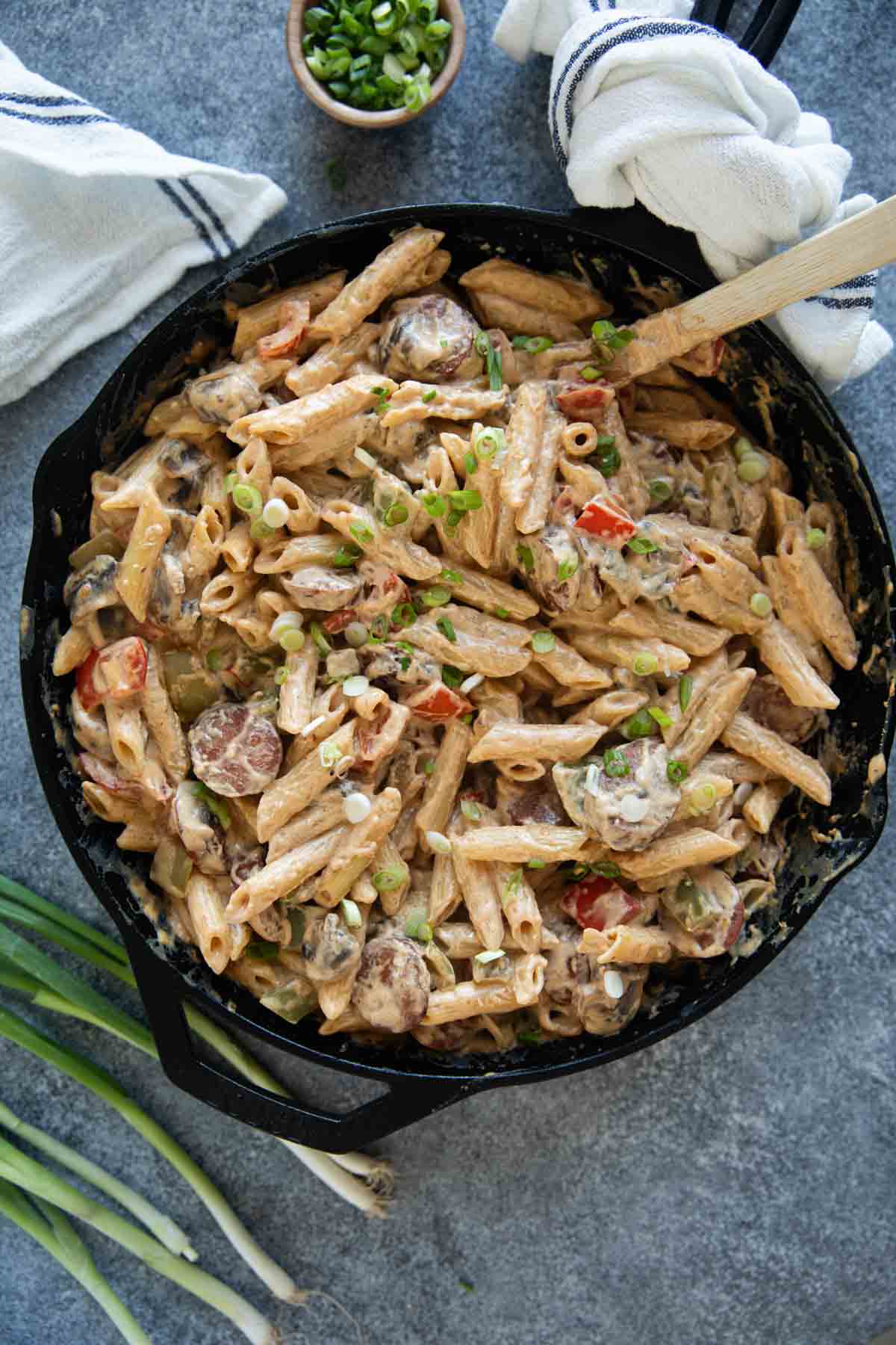 Cajun Sausage Pasta in a cast iron skillet.