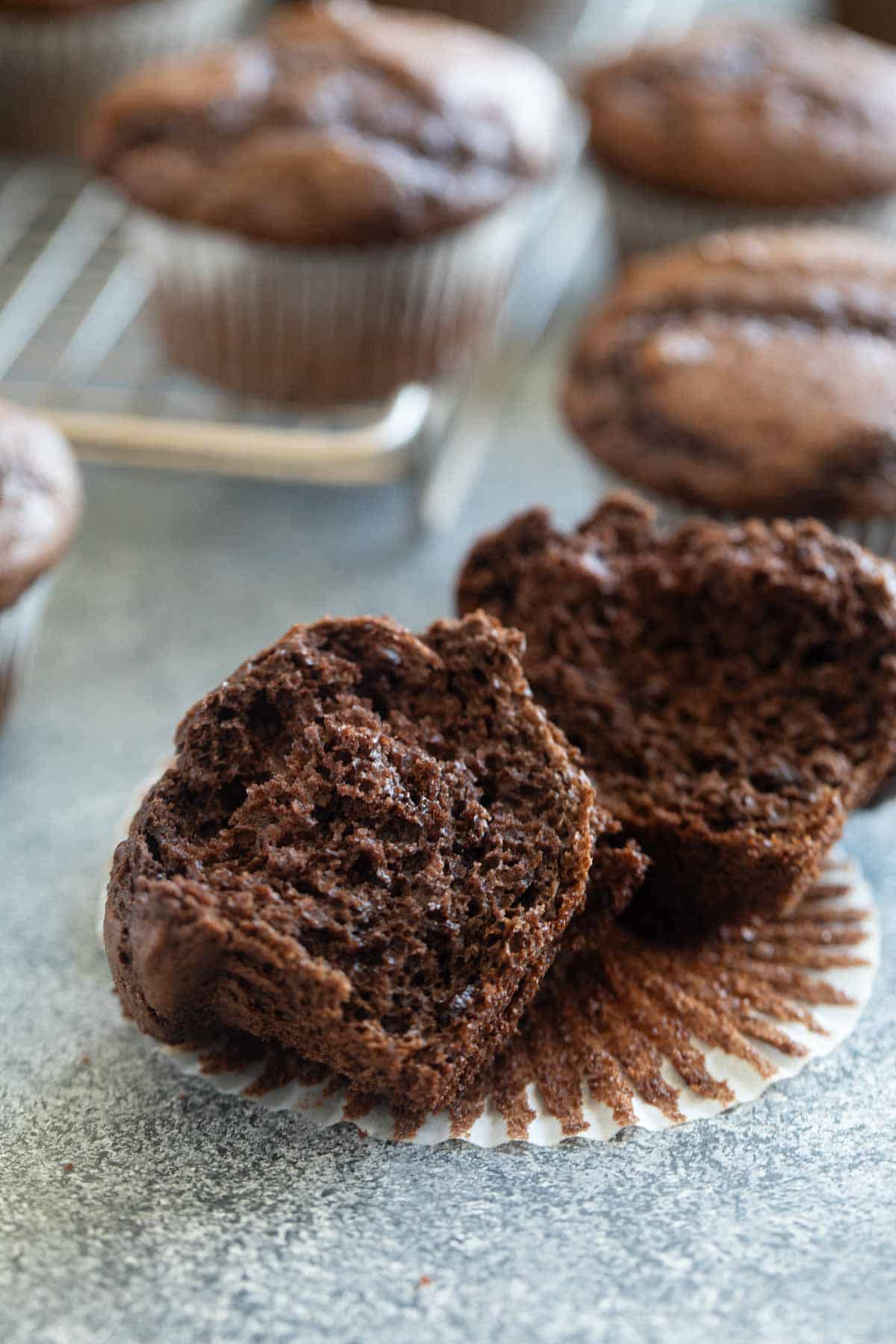 Chocolate cake mix muffin broken in half.