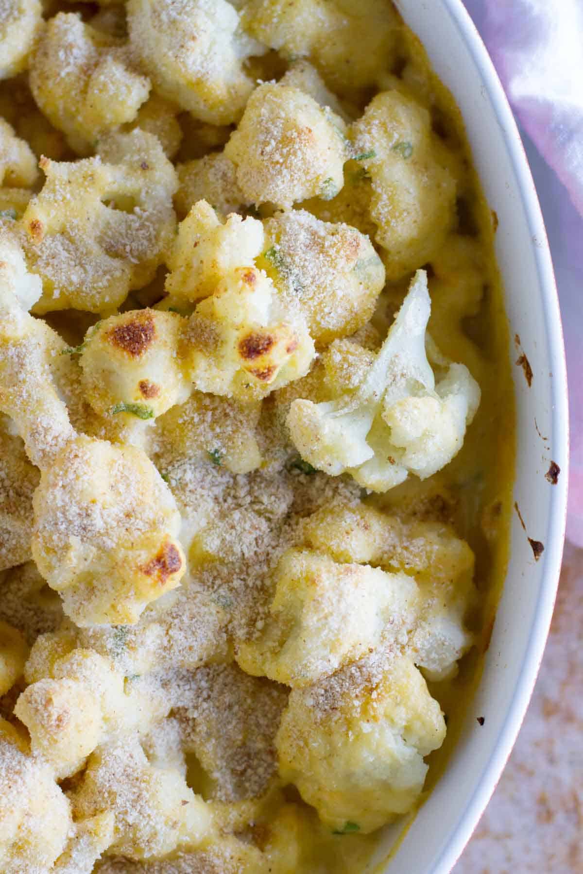 Baking dish full of Cheddar Cauliflower Gratin.