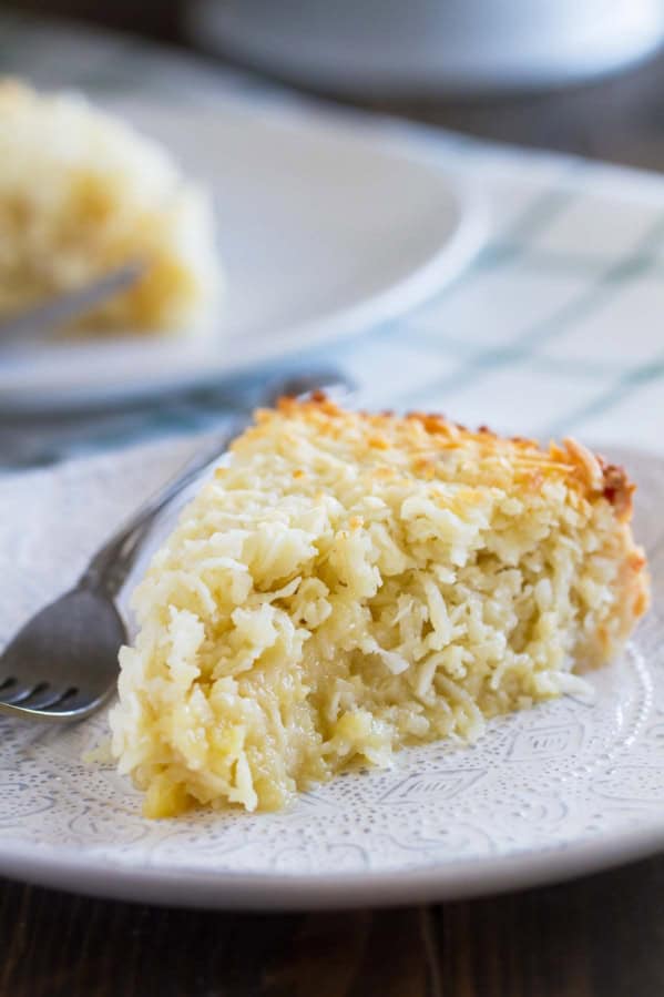 Slice of Coconut Custard Pie on a plate.