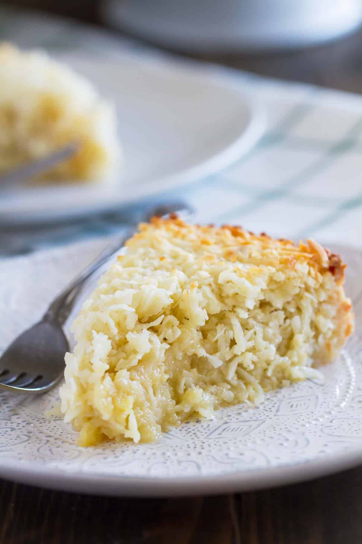 Slice of Coconut Custard Pie on a plate.