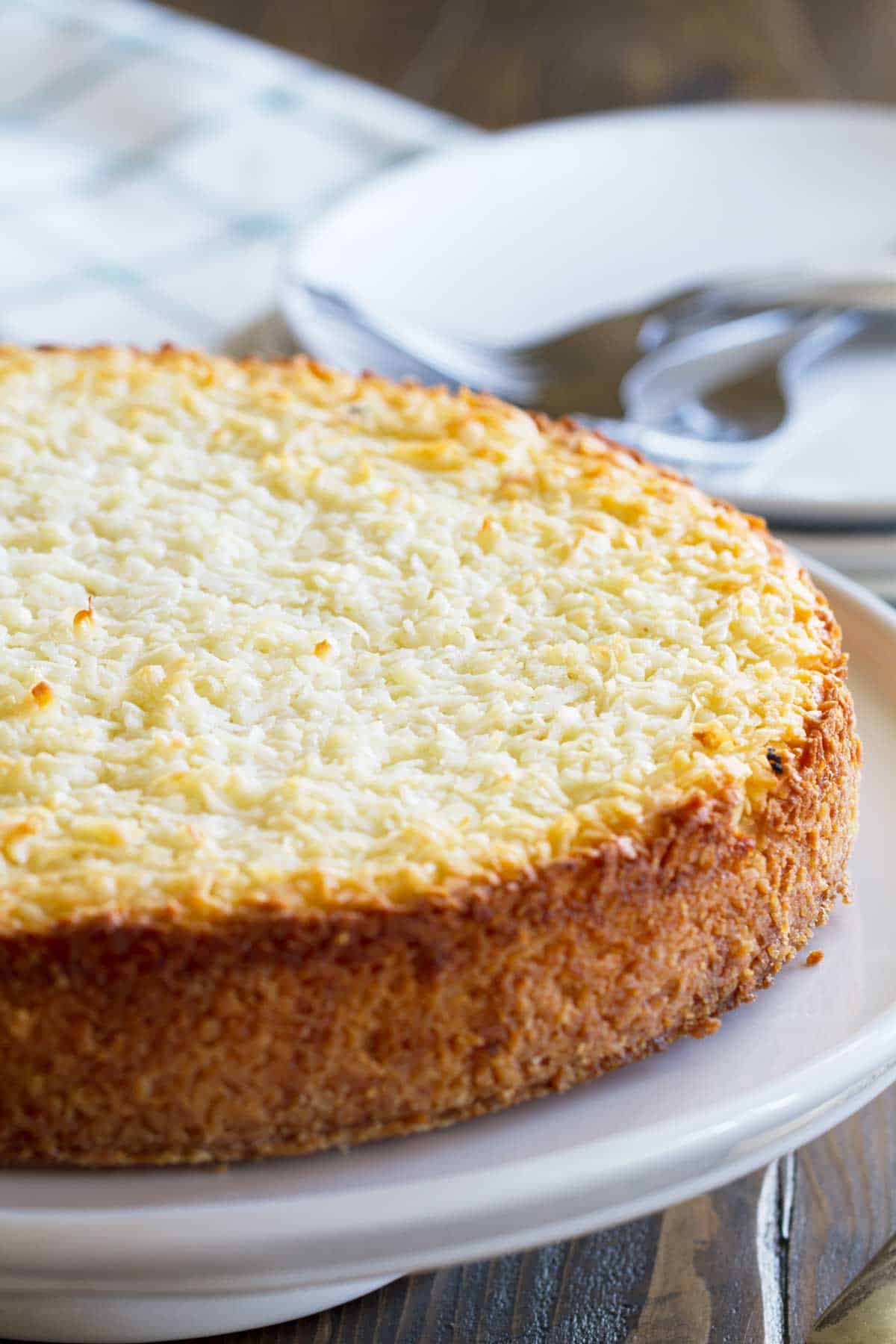 Full Coconut Custard Pie on a serving platter.