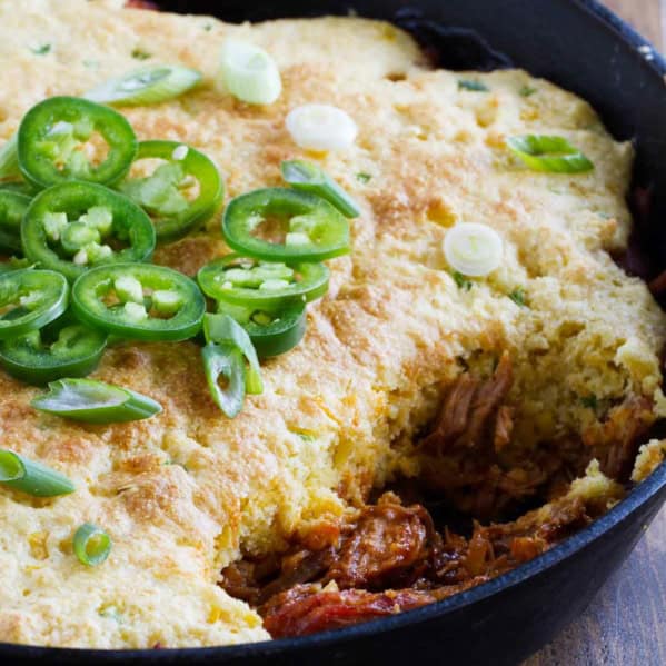 Cornbread Topped BBQ Pork with a scoop taken out.