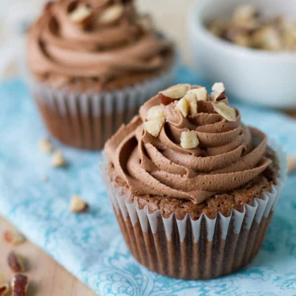 Hazelnut Brownie Cupcakes with Hazelnut Buttercream with fresh hazelnuts on top.