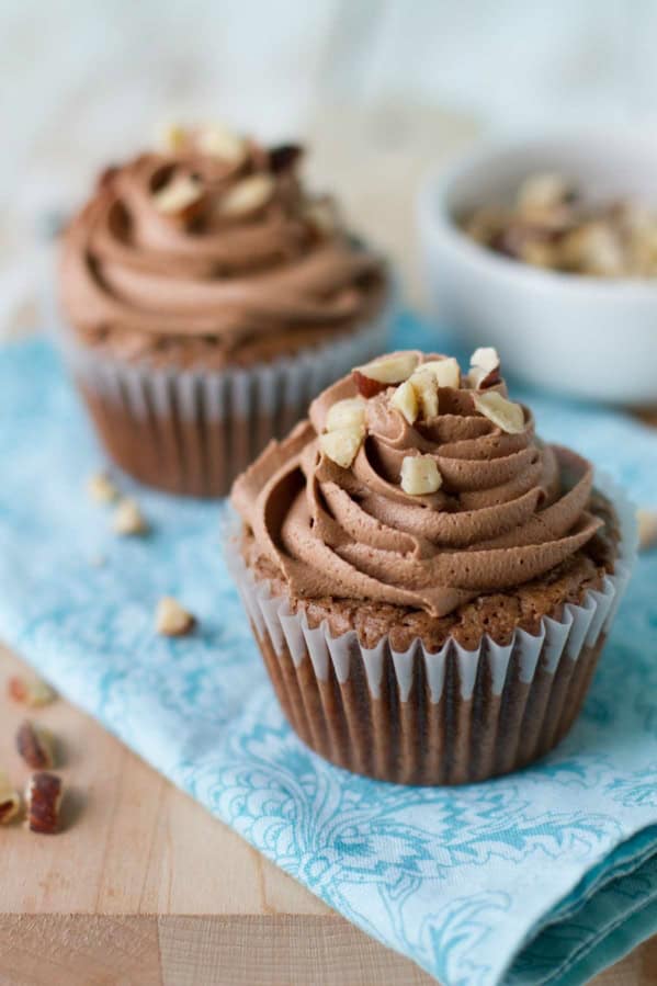 Hazelnut Brownie Cupcakes with Hazelnut Buttercream with fresh hazelnuts on top.