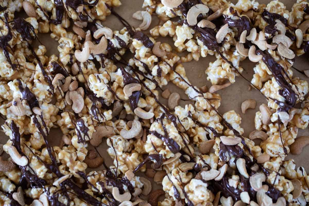 Peanut Butter, Chocolate, and Cashew Popcorn on a baking sheet.