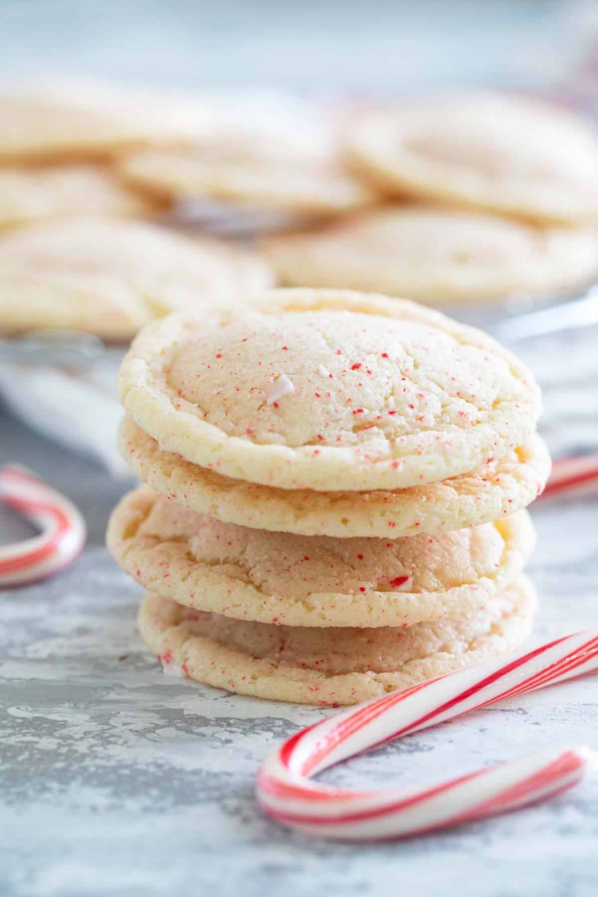 Four peppermint snickerdoodles stacked on top of each other.