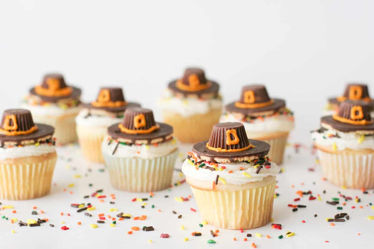 Pilgrim Hat Thanksgiving Cupcakes with fall sprinkles.