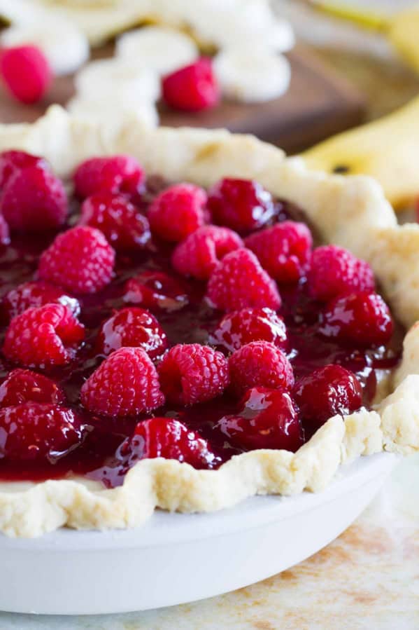 Raspberry Banana Pie - banana cream pie topped with raspberry sauce and fresh raspberries.