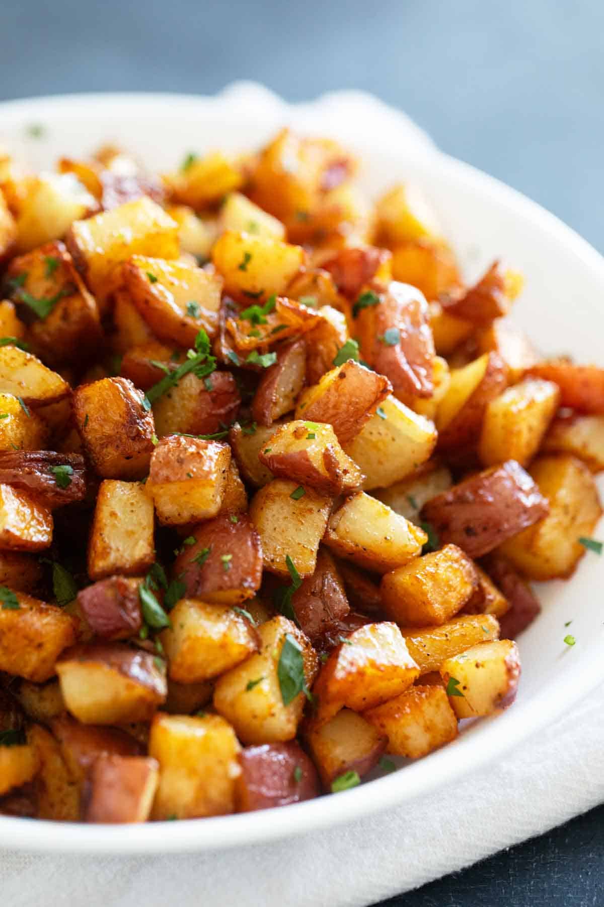 Oven roasted Breakfast Potatoes sprinkled with parsley.