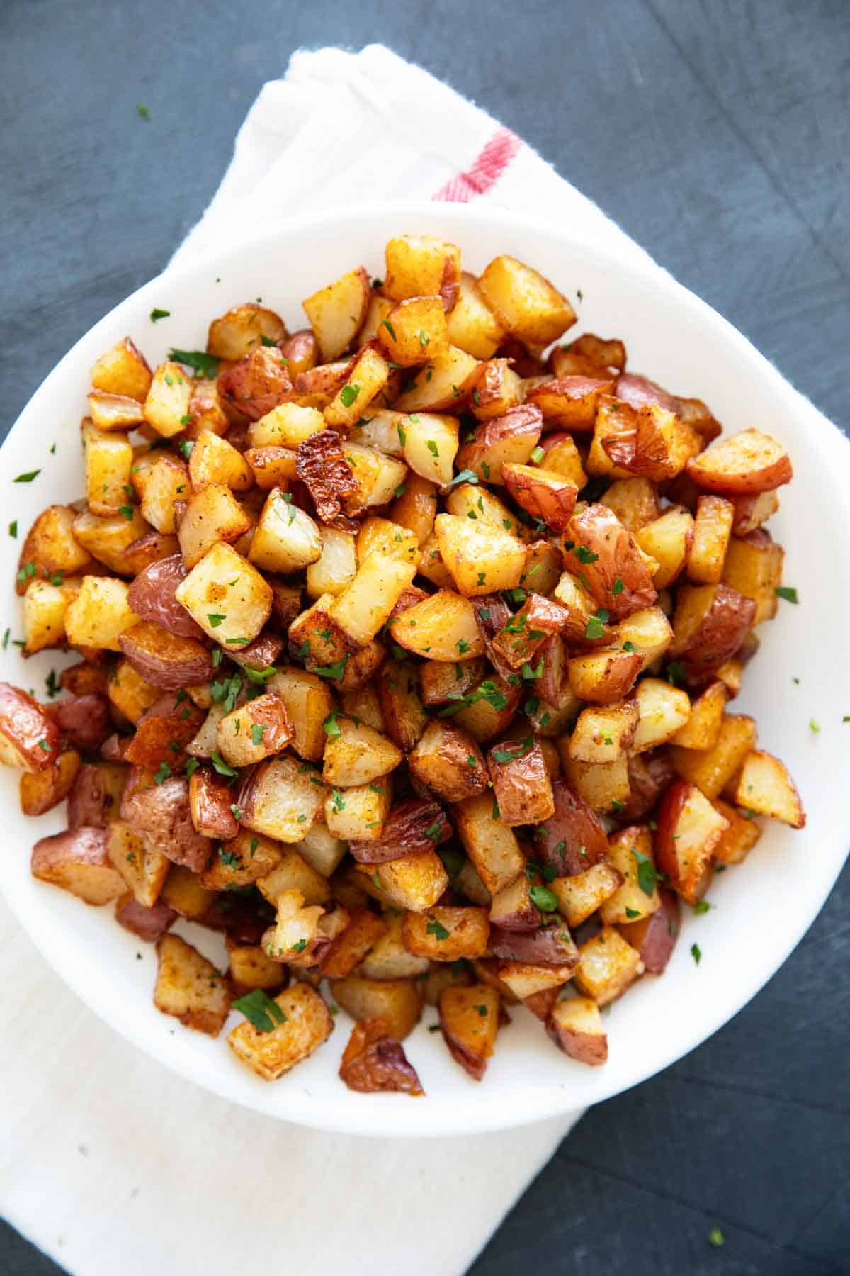 Plate filled with breakfast potatoes.