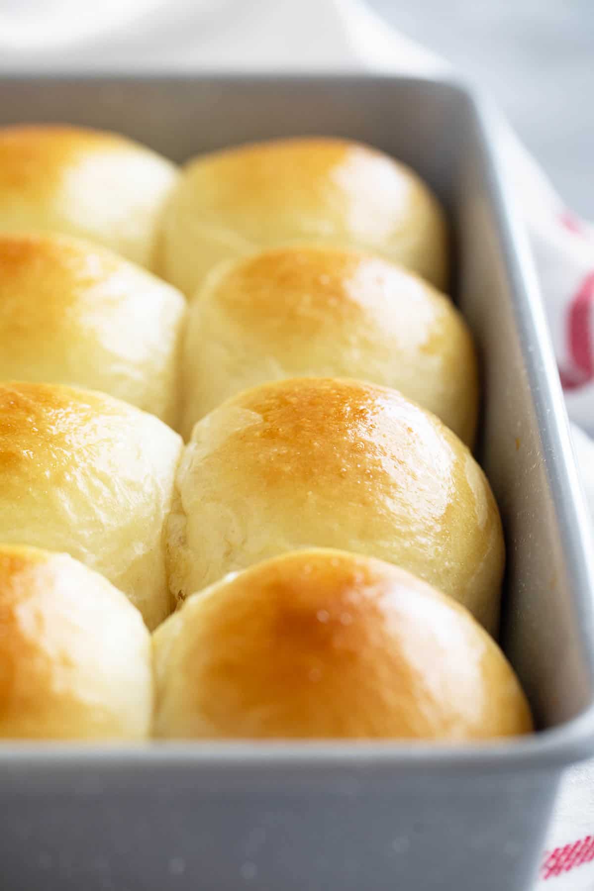 Baked Brioche Rolls in a baking dish.