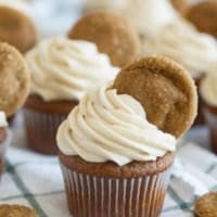 Gingerbread Cupcakes topped with brown sugar cream cheese icing and a ginger cookie.