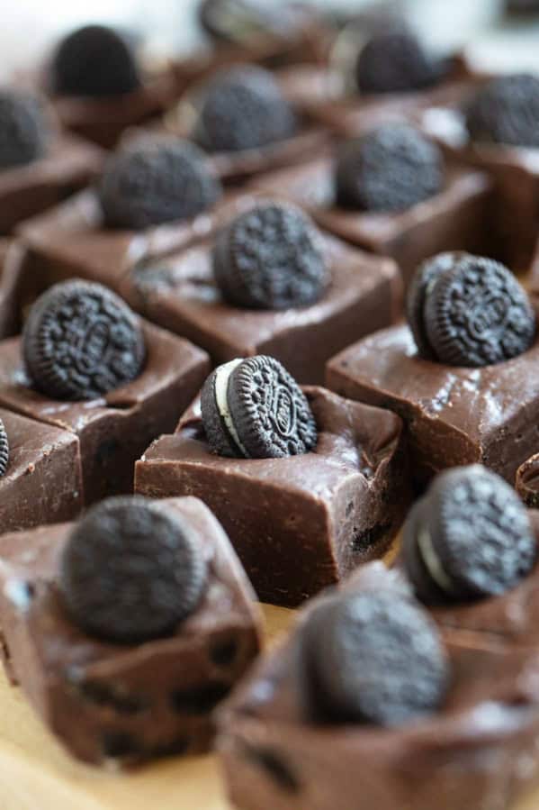 Squares of Oreo Fudge topped with mini Oreo cookies.