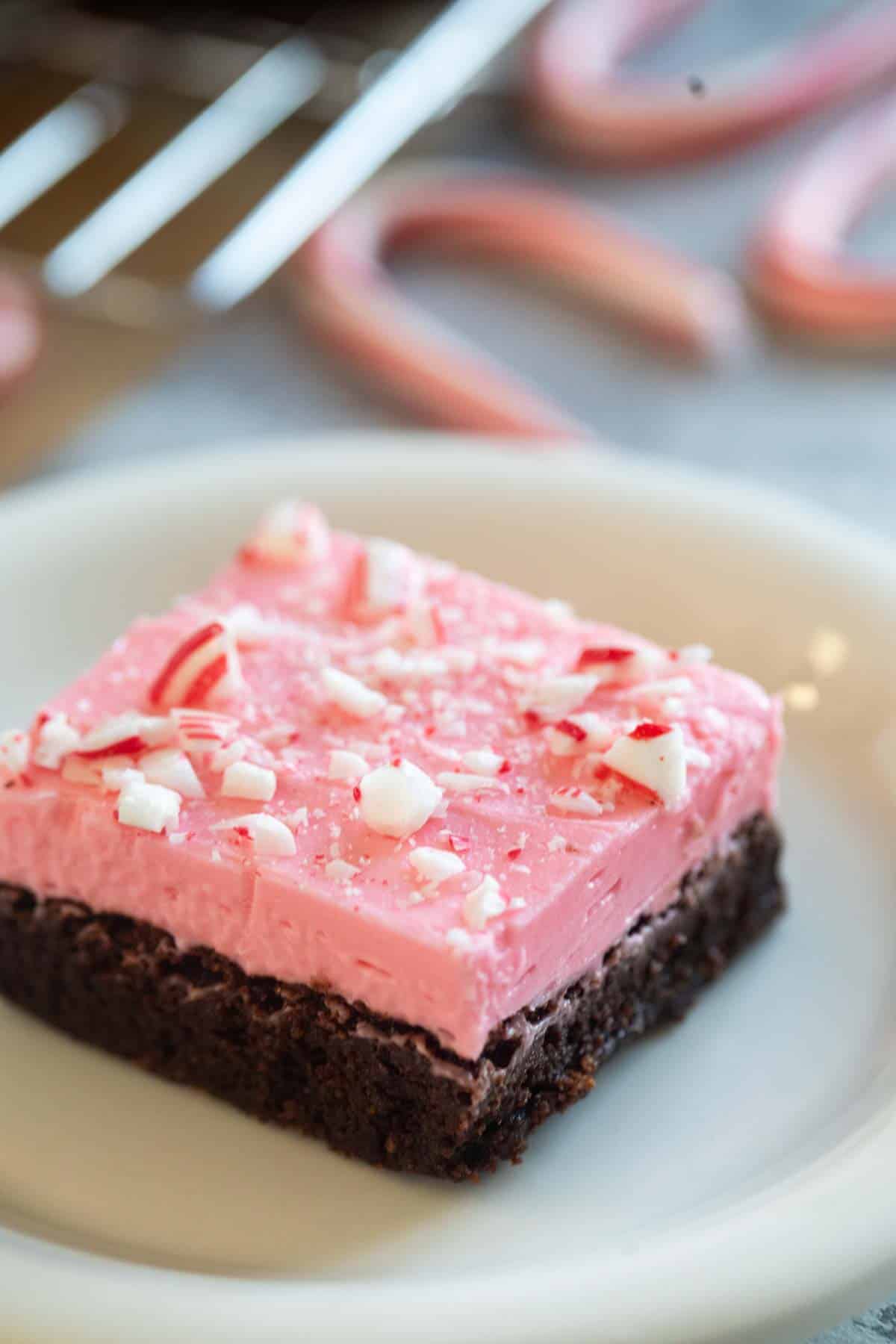 Peppermint brownie topped with cream cheese frosting and crushed candy canes.