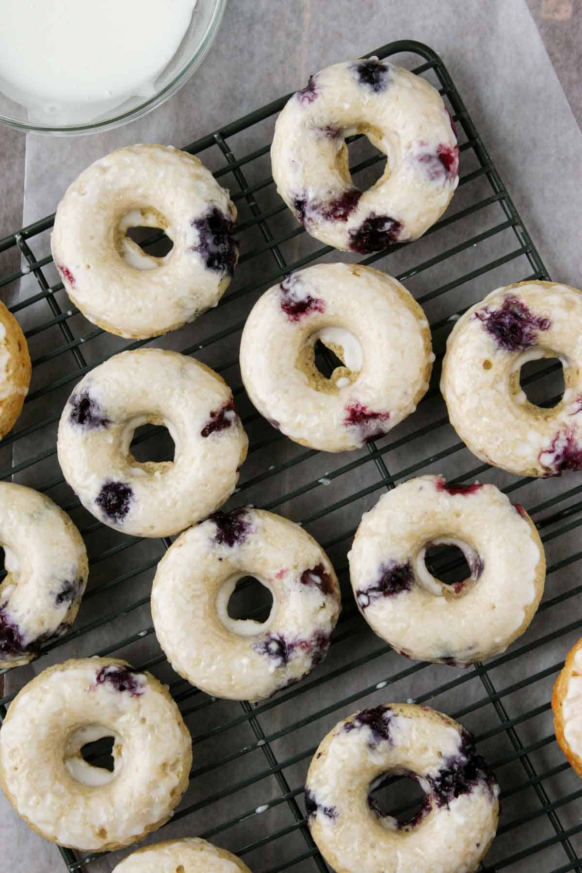 Blueberry Cherry Baked Donuts on a cooling rack.