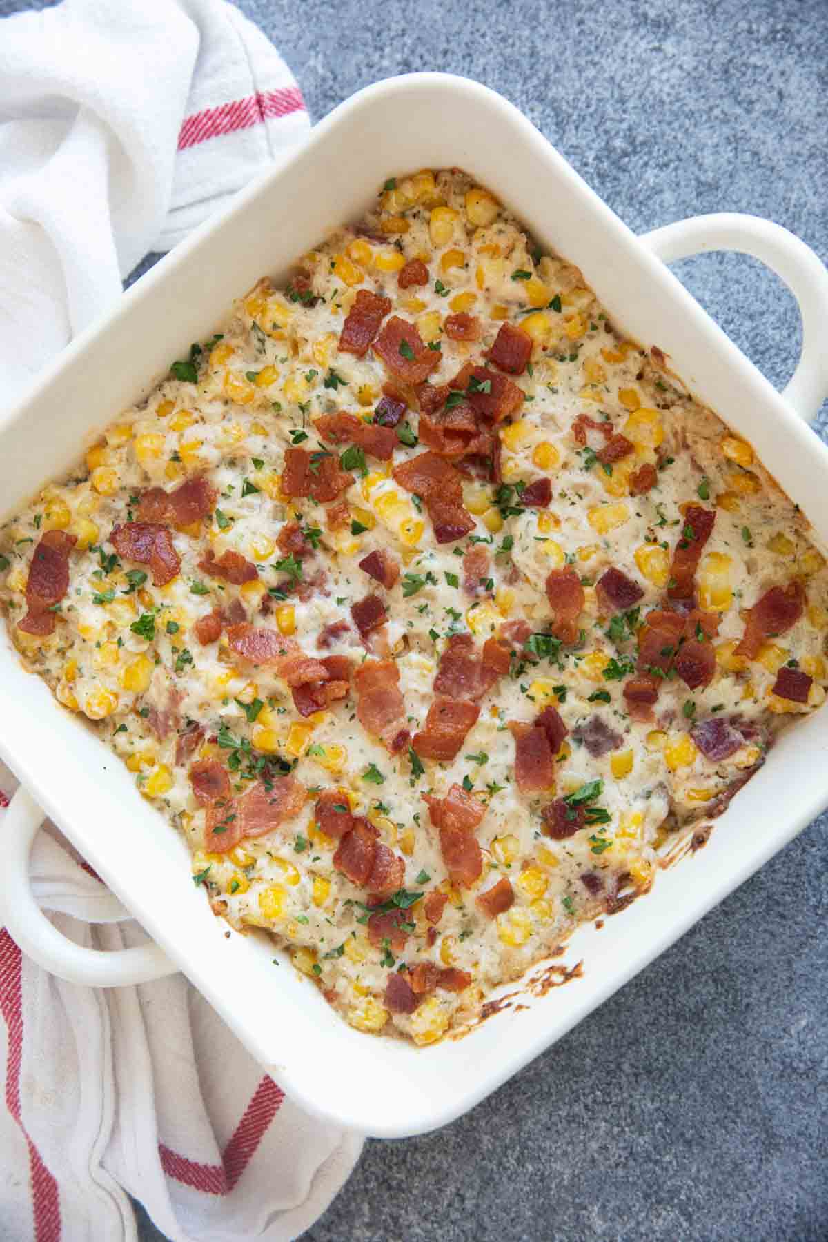 Casserole dish filled with Creamy Corn and Bacon.