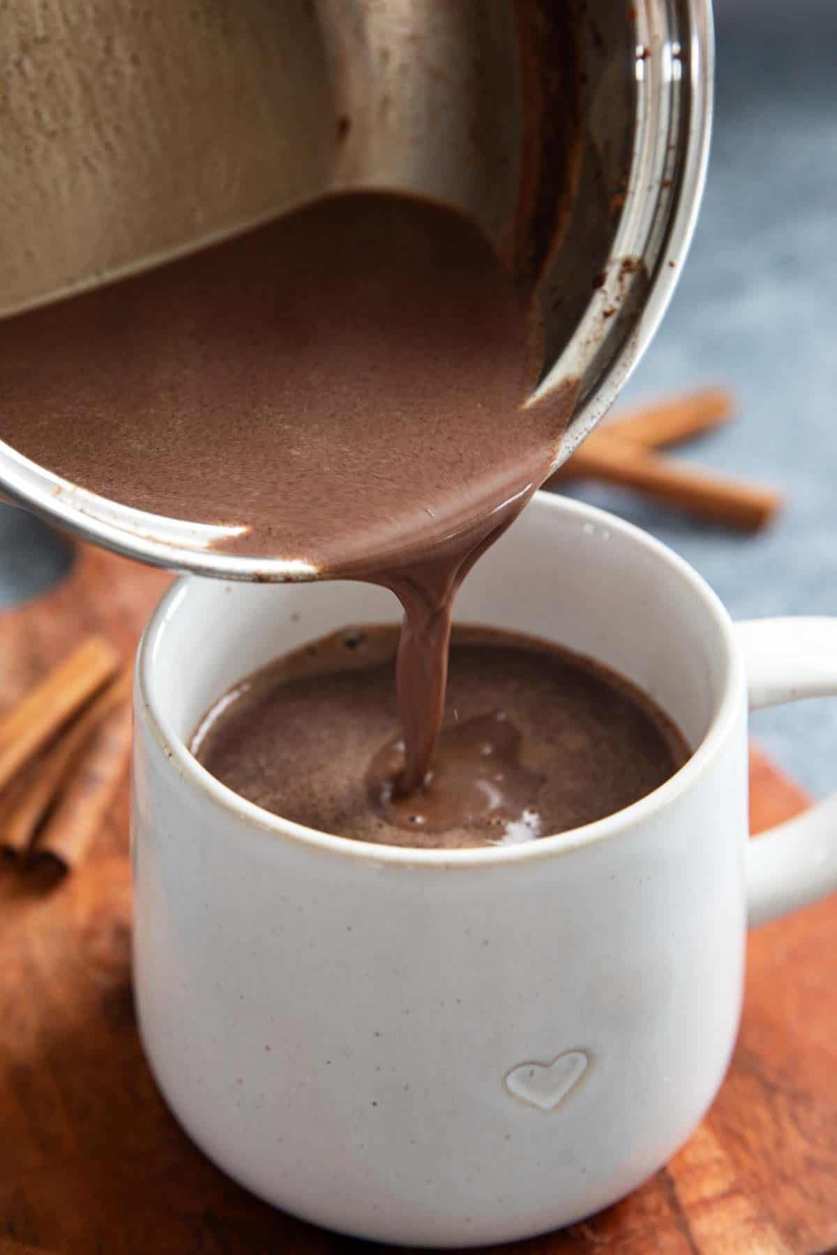 Pouring Mexican Hot Chocolate into a mug.