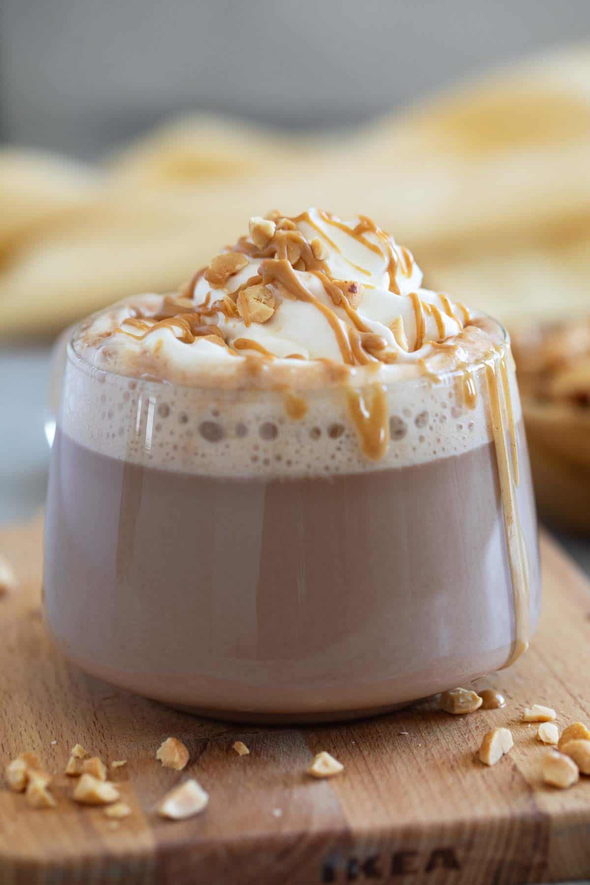 Peanut Butter Hot Chocolate topped with peanut butter and peanuts.