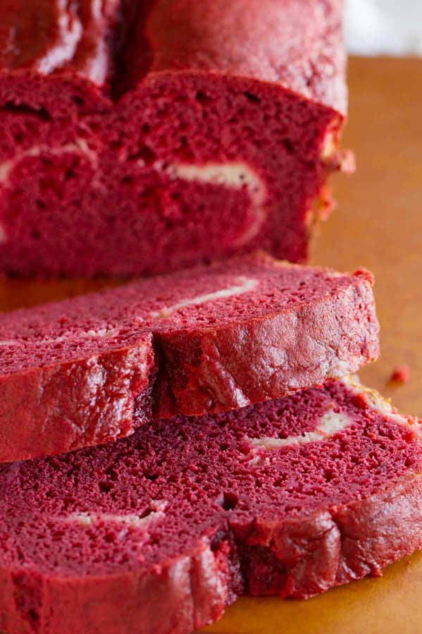 Slices of red velvet quick bread showing texture.