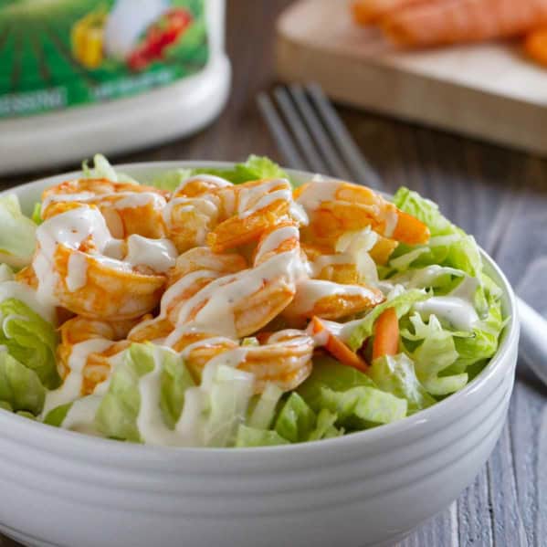 Buffalo Ranch Shrimp Salad topped with easy buffalo shrimp.