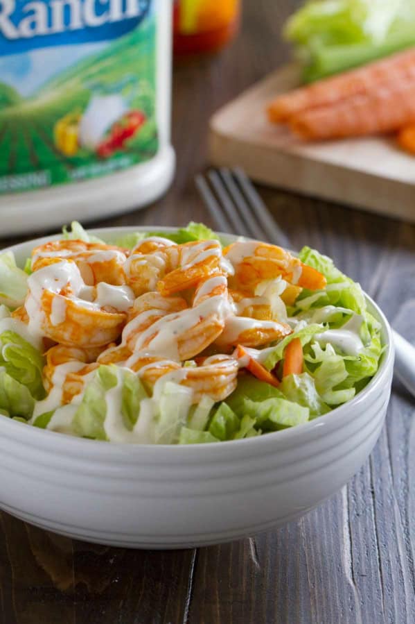 Buffalo Ranch Shrimp Salad topped with easy buffalo shrimp.