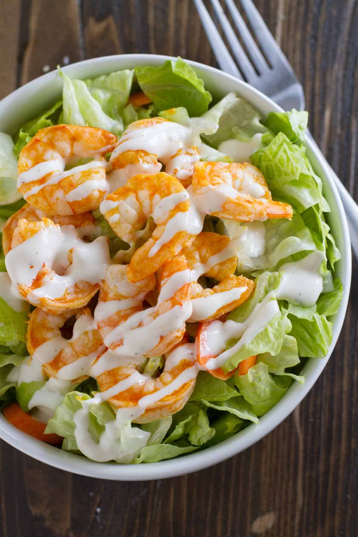 Buffalo Ranch Shrimp Salad with lettuce, buffalo shrimp, and ranch dressing.