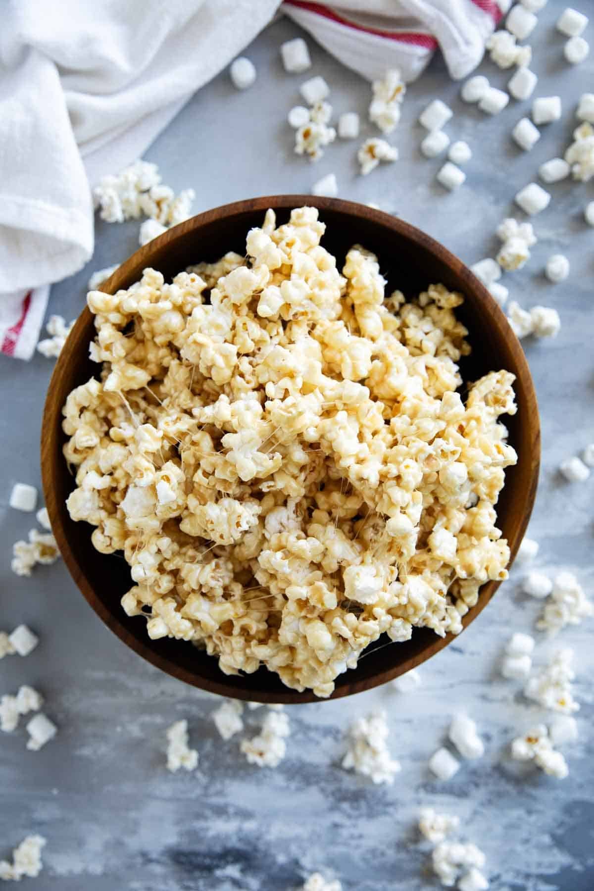 Caramel Marshmallow Popcorn in a wooden bowl.