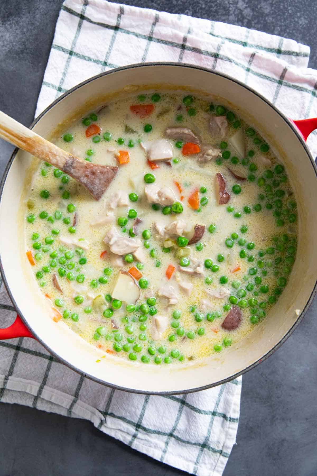 Dutch oven with chicken stew with vegetables.