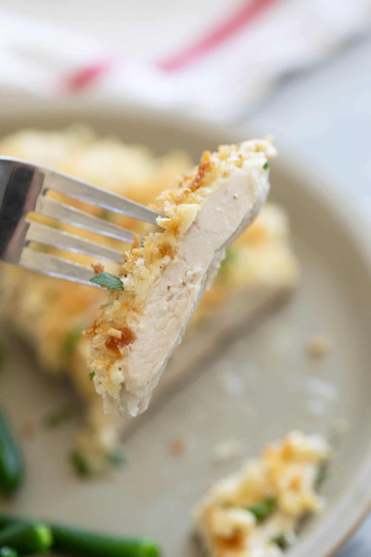 Bite of crunchy mayo chicken on a fork.