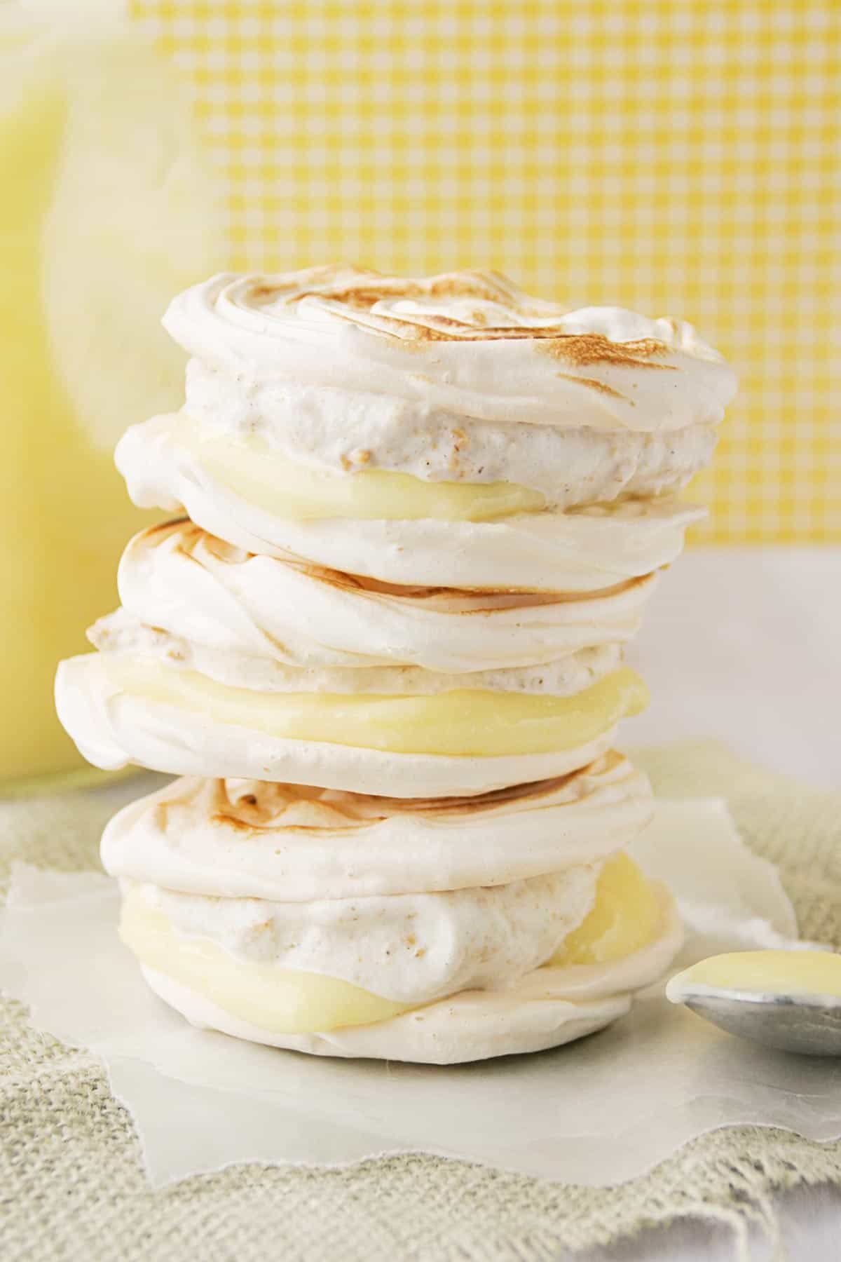 Lemon Meringue Hand Pies with graham cracker ice cream and lemon curd with meringue cookies.