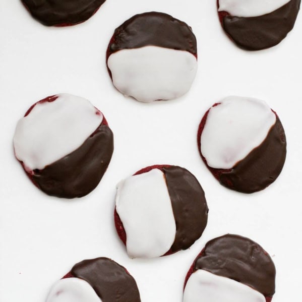 Red velvet black and white cookies on a white background.