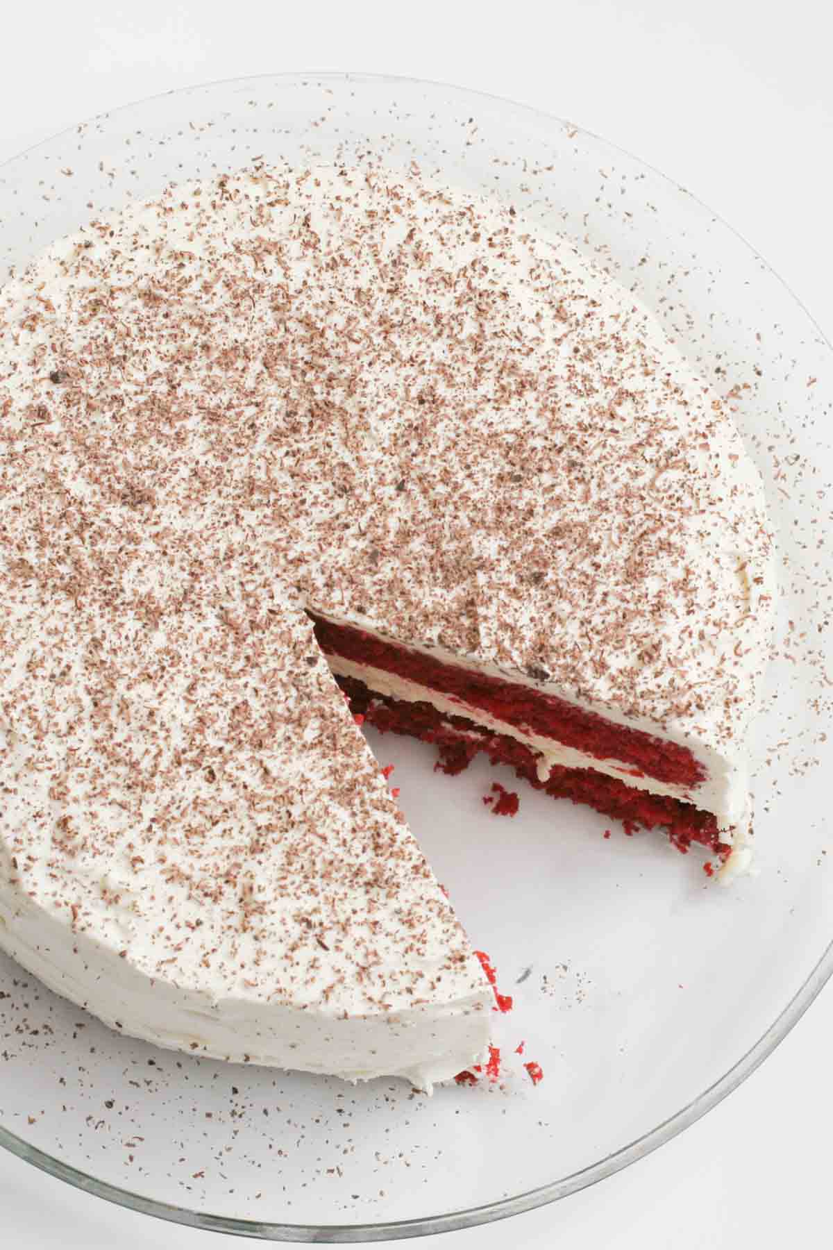 Red Velvet Cheesecake Cake with a slice taken from it.