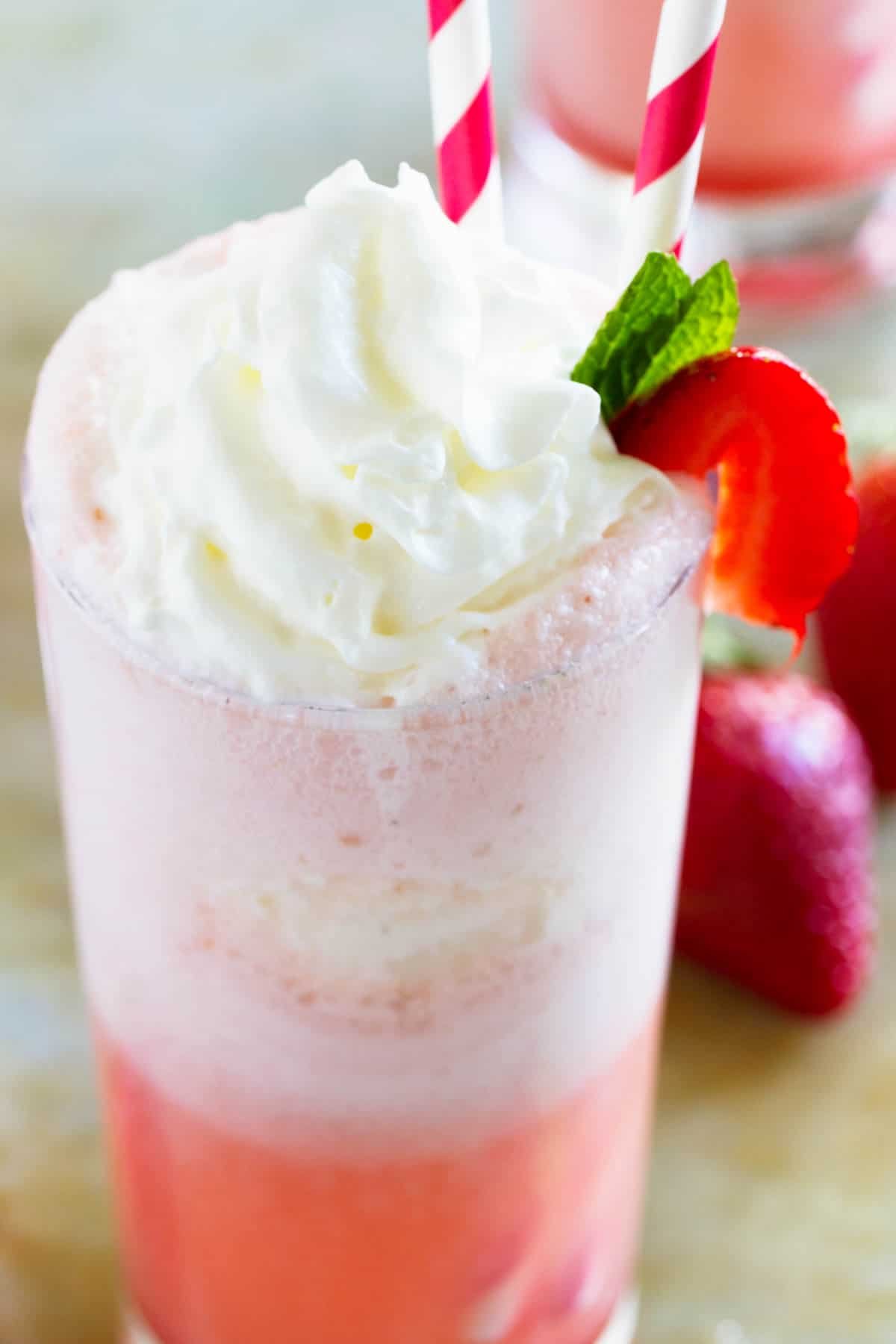 Strawberry Cream Float topped with whipped cream and a strawberry.