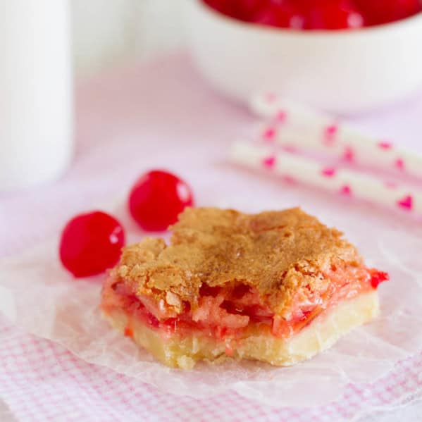 Coconut Cherry Almond Bar with a bite taken from it.