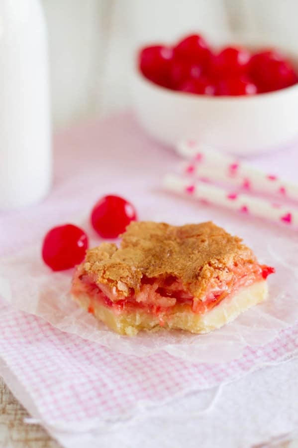 Coconut Cherry Almond Bar with a bite taken from it.