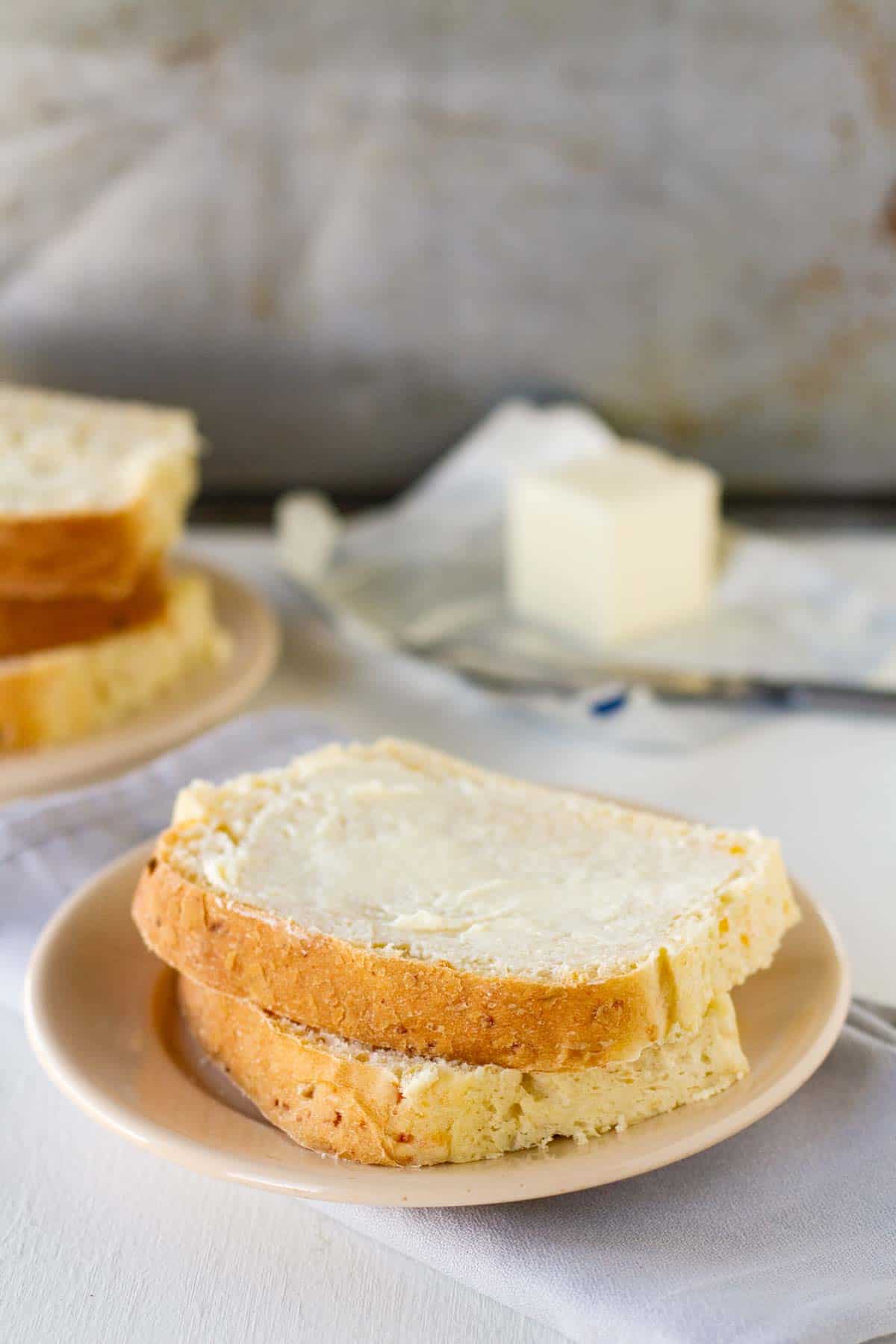 Two slices of Green Chile Cheddar Bread on a plate.