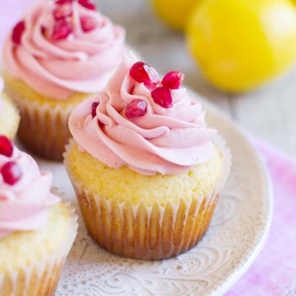 Lemon Pomegranate Cupcakes on a plate.