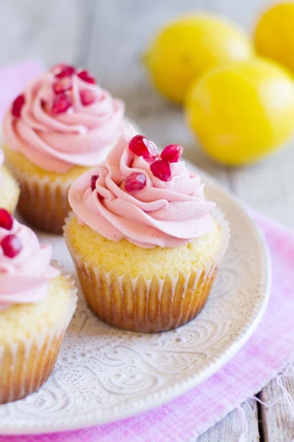 Lemon Pomegranate Cupcakes on a plate.