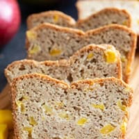 Slices of Mango Bread stacked next to each other.