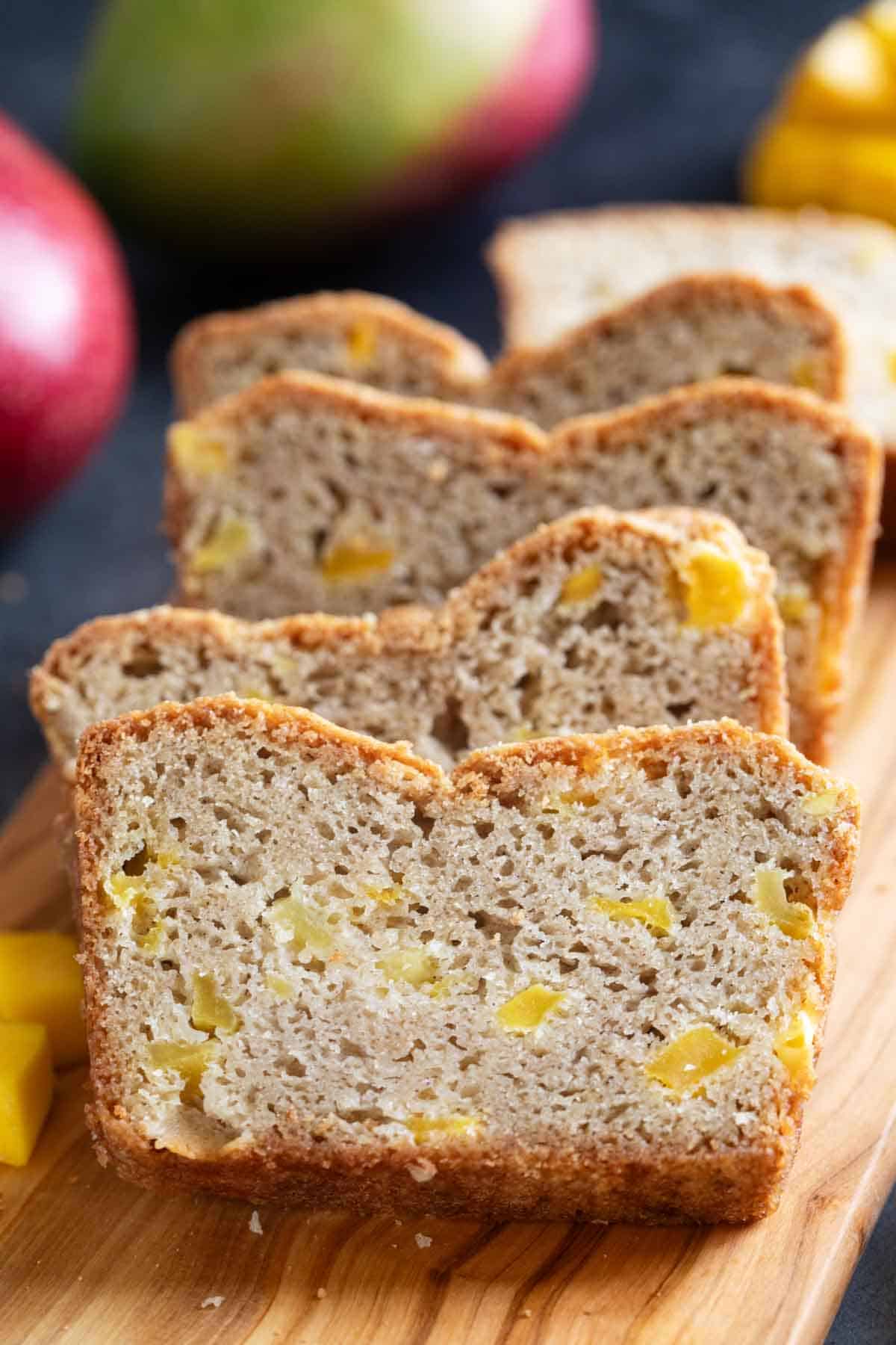 Slices of Mango Bread stacked next to each other.