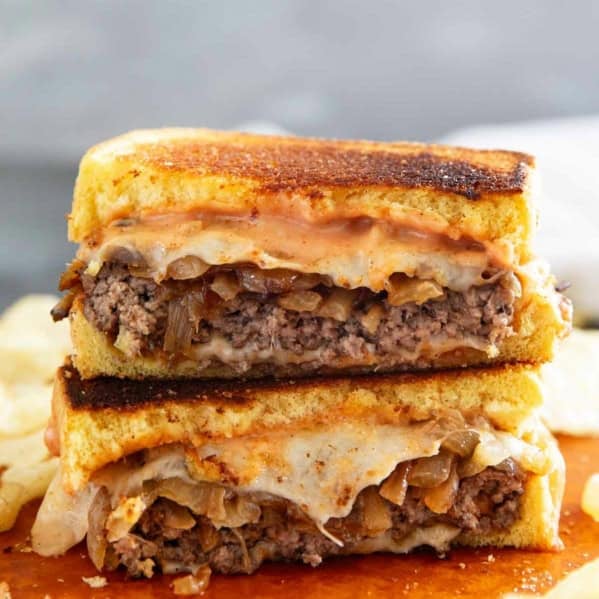 Patty Melt cut in half and stacked.